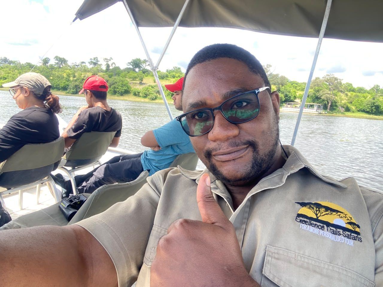 Excellence Trails guide smiling aboard a Chobe River cruise with guests